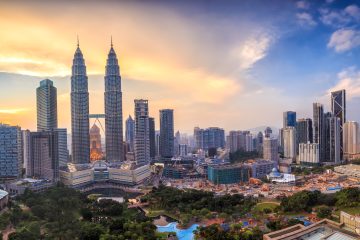 City skyline view of Kuala Lumpur at twilight in Malaysia - an affordable student travel destination.