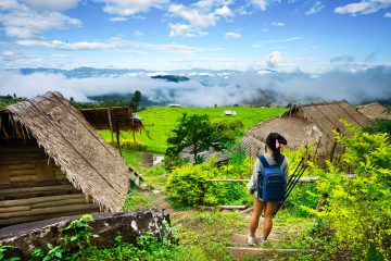 A girl standing in the rice terraces of Bali.