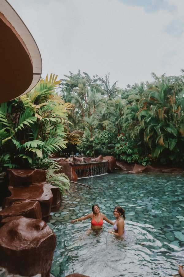 Two girls swimming in a pool in Costa Rica