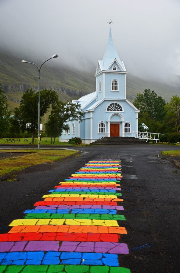 The blue church of Seyðisfjörður in east of Iceland. Iceland is on our LGBTQ+ itinerary because it's one of the safest countries in the world for members of the LGBTQ+ community.