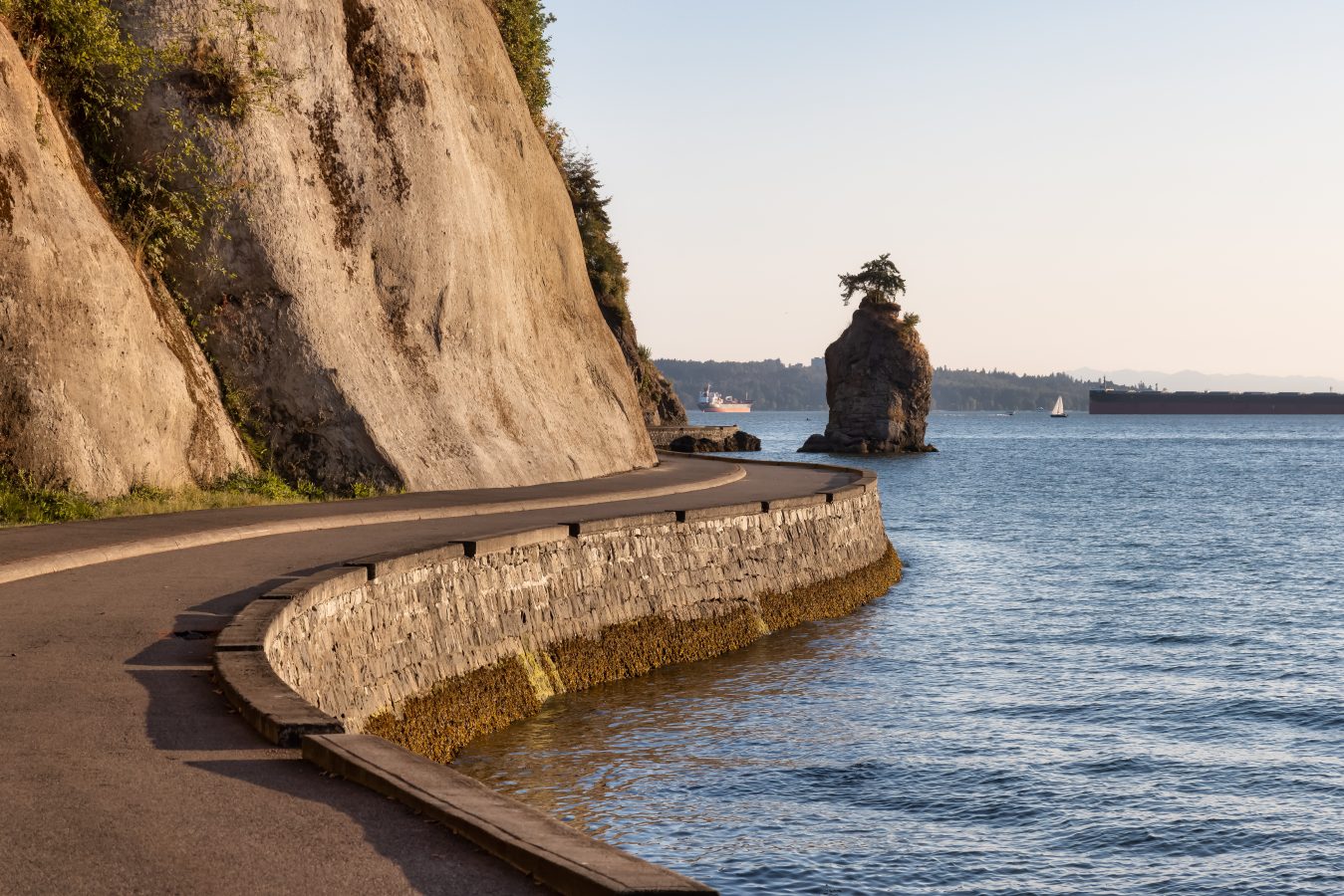 View of the Siwash Rock from Seawall at Stanley Park in Vancouver, British Columbia, Canada.
