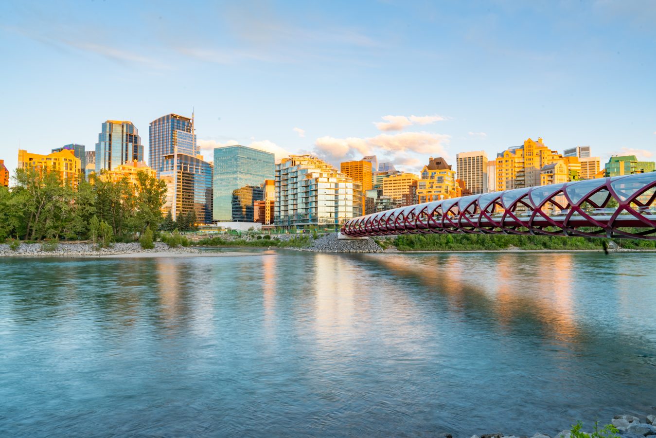 Skyline of the city Calgary, Alberta, Canada along the Bow River with Peace Bridge