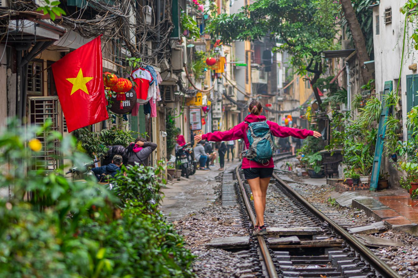 Traveler tourist walking on train rail in Hanoi, Vietnam.